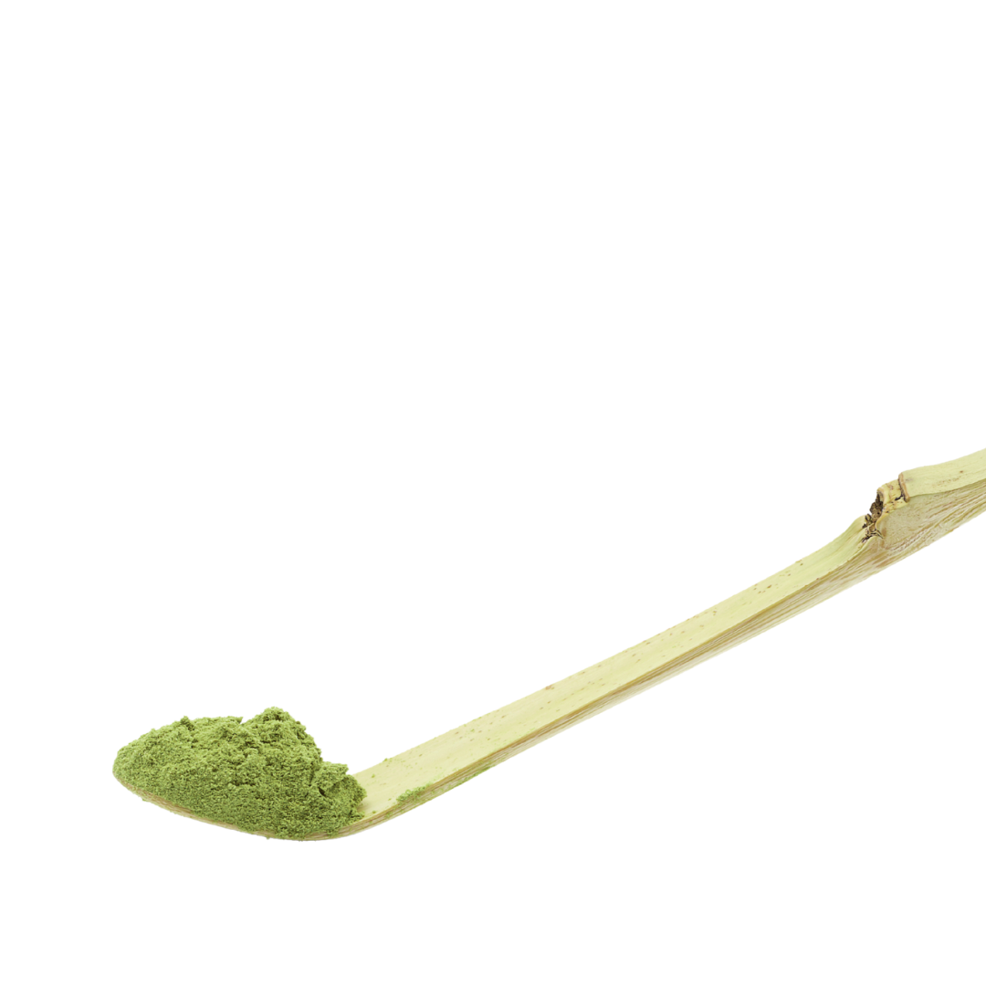 Wooden spoon with green powder on a white background